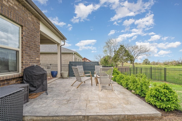 view of patio / terrace with outdoor dining area, a fenced backyard, and a grill