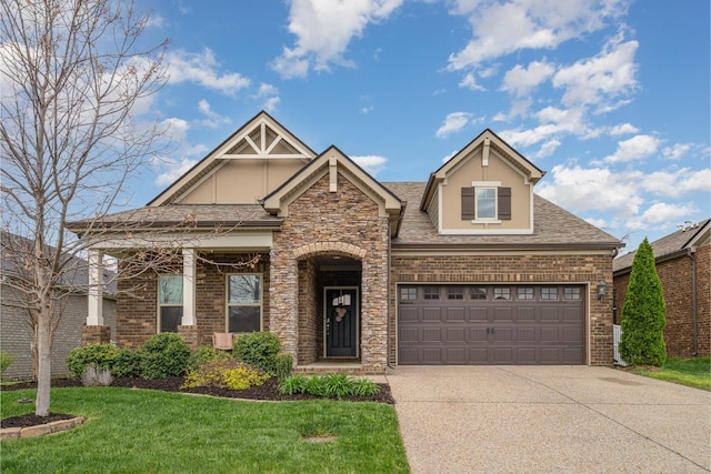 craftsman inspired home featuring a garage, a front lawn, brick siding, a shingled roof, and concrete driveway
