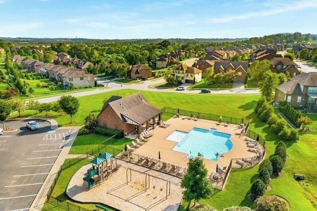 birds eye view of property with a residential view