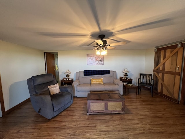 living room with wood finished floors, baseboards, and ceiling fan