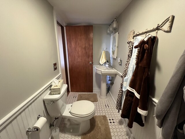 half bath featuring toilet