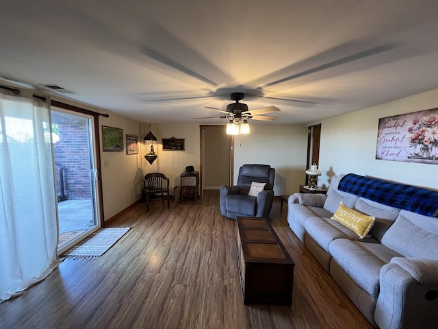 living area featuring wood finished floors and a ceiling fan