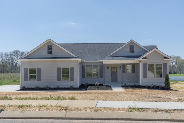 view of front of home with a shingled roof