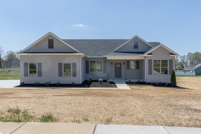 view of front of property with roof with shingles