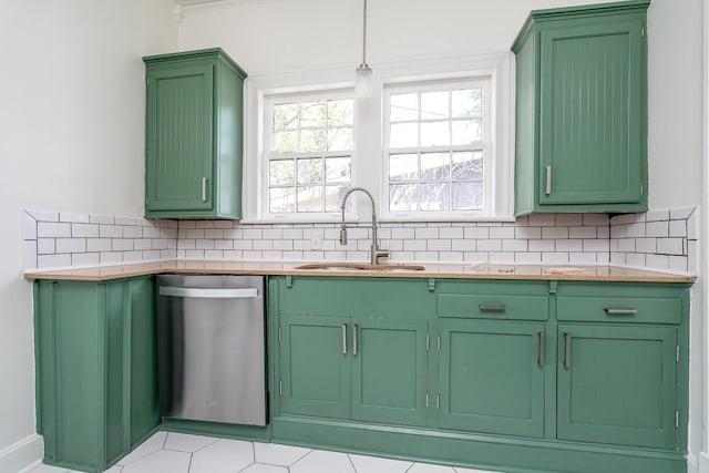 906 Myers Ave, Columbia, TN 38401 - kitchen with stainless steel dishwasher, a sink, decorative backsplash, green cabinets, and light countertops
