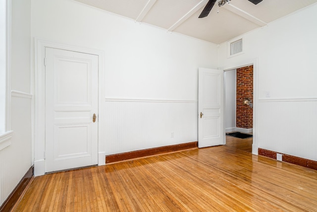 906 Myers Ave, Columbia, TN 38401 - spare room featuring visible vents, light wood finished floors, a ceiling fan, and a wainscoted wall