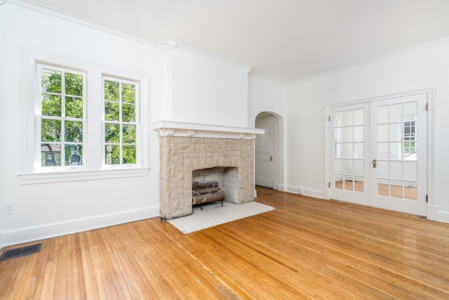 906 Myers Ave, Columbia, TN 38401 - unfurnished living room featuring visible vents, baseboards, a fireplace, ornamental molding, and wood-type flooring