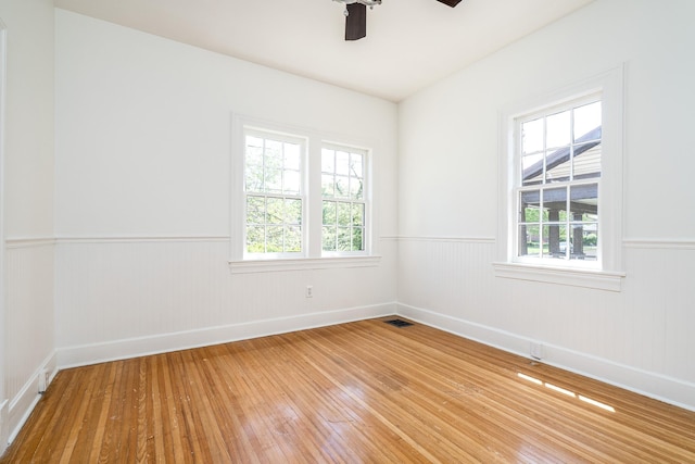 906 Myers Ave, Columbia, TN 38401 - empty room featuring wainscoting, ceiling fan, and light wood-style flooring