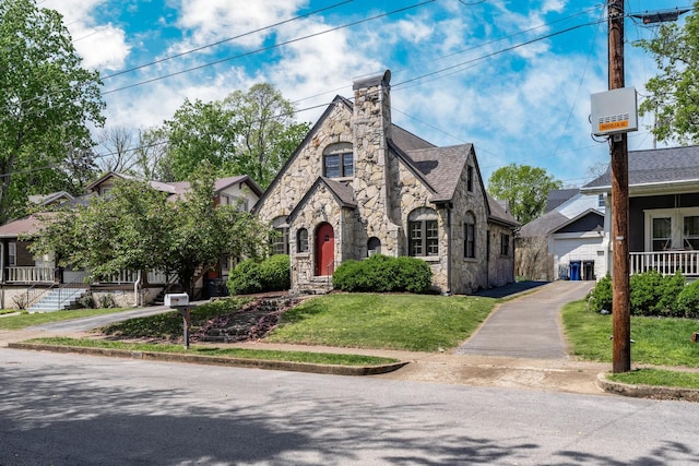 906 Myers Ave, Columbia, TN 38401 - tudor house with stone siding and a front yard
