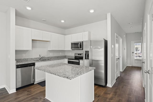 810 Dallas Dr, Columbia, TN 38401 - kitchen with white cabinetry, light stone counters, dark wood-style flooring, a sink, and stainless steel appliances