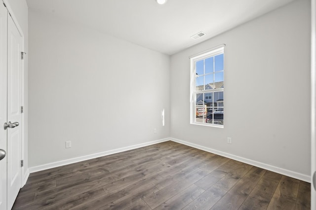 810 Dallas Dr, Columbia, TN 38401 - unfurnished bedroom featuring visible vents, dark wood-style flooring, and baseboards