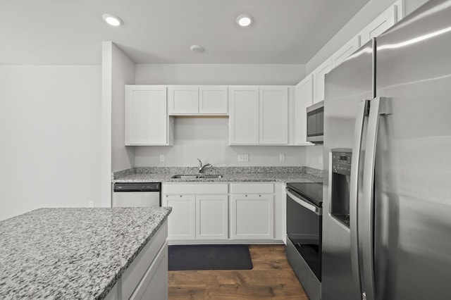 810 Dallas Dr, Columbia, TN 38401 - kitchen featuring dark wood-type flooring, white cabinets, recessed lighting, a sink, and stainless steel appliances