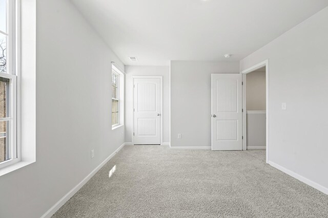 810 Dallas Dr, Columbia, TN 38401 - unfurnished bedroom with baseboards, multiple windows, and carpet floors