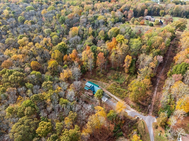 drone / aerial view featuring a view of trees