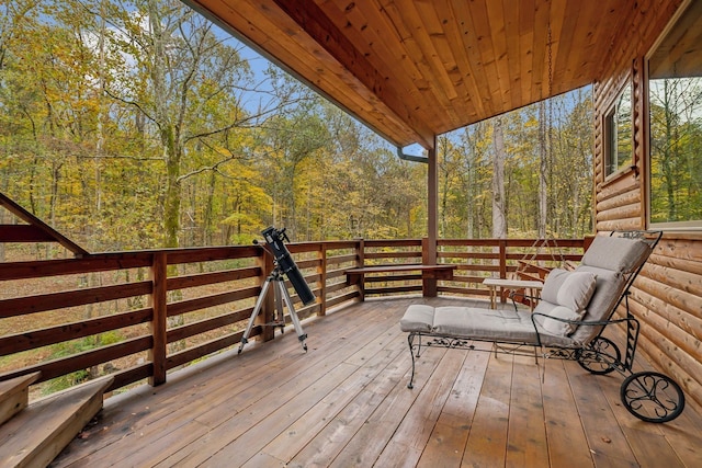 wooden terrace with a forest view