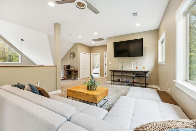 living area with light colored carpet, a ceiling fan, visible vents, and recessed lighting