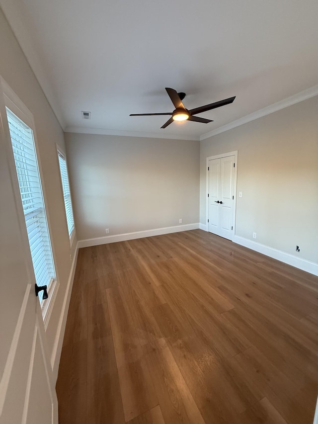 1168 N Franklin Ave, Cookeville, TN 38501 - unfurnished bedroom with wood finished floors, ornamental molding, baseboards, and ceiling fan