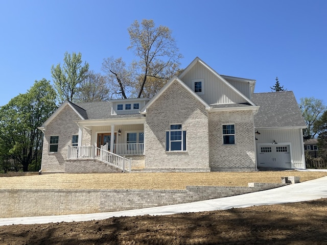 1168 N Franklin Ave, Cookeville, TN 38501 - craftsman house with covered porch, brick siding, a garage, and board and batten siding