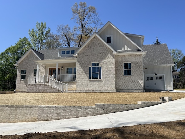 1168 N Franklin Ave, Cookeville, TN 38501 - craftsman inspired home with a porch, a garage, brick siding, and board and batten siding