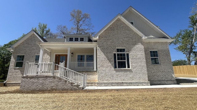 1168 N Franklin Ave, Cookeville, TN 38501 - view of front of property with a porch, brick siding, stairs, and board and batten siding