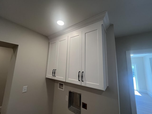 1168 N Franklin Ave, Cookeville, TN 38501 - washroom with cabinet space, electric dryer hookup, hookup for a washing machine, light wood-type flooring, and baseboards