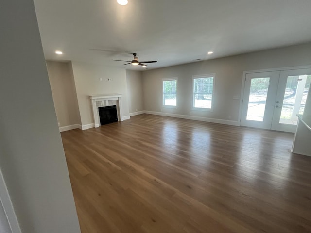 1168 N Franklin Ave, Cookeville, TN 38501 - unfurnished living room featuring a ceiling fan, wood finished floors, recessed lighting, a tile fireplace, and baseboards