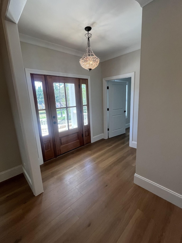 1168 N Franklin Ave, Cookeville, TN 38501 - entryway with dark wood-type flooring, baseboards, a chandelier, and ornamental molding