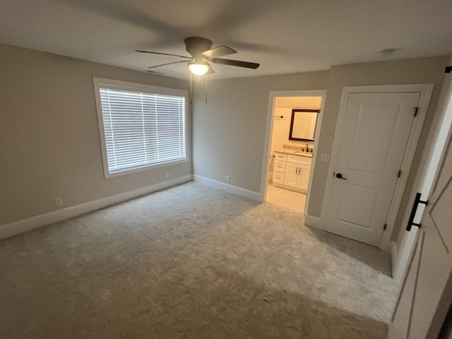 1168 N Franklin Ave, Cookeville, TN 38501 - unfurnished bedroom with light colored carpet, a sink, baseboards, and ensuite bath