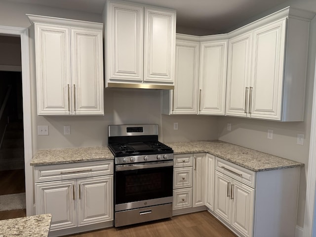 1168 N Franklin Ave, Cookeville, TN 38501 - kitchen featuring stainless steel gas range oven, wood finished floors, white cabinetry, and light stone countertops