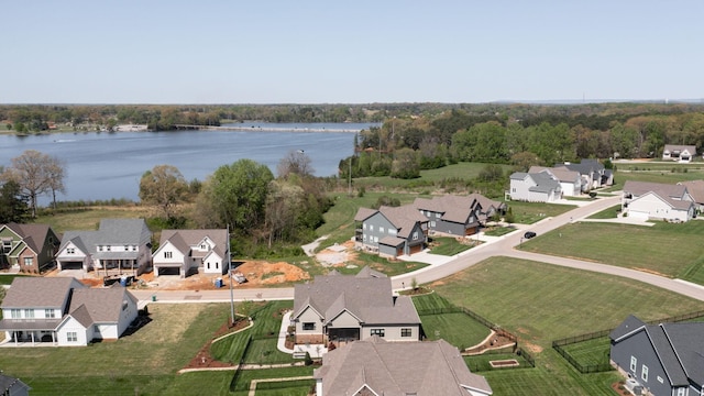 bird's eye view featuring a water view and a residential view
