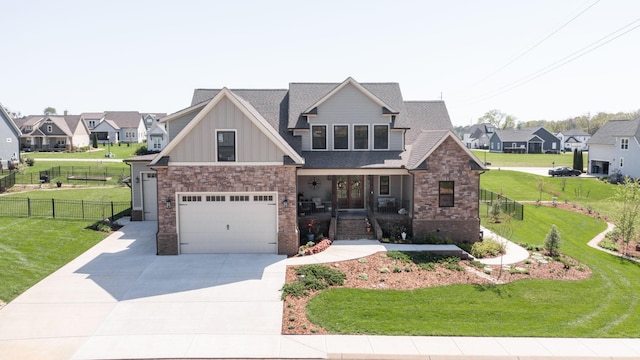 craftsman inspired home featuring driveway, board and batten siding, and a front lawn