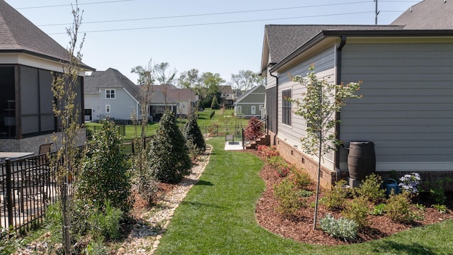view of yard featuring a residential view and fence
