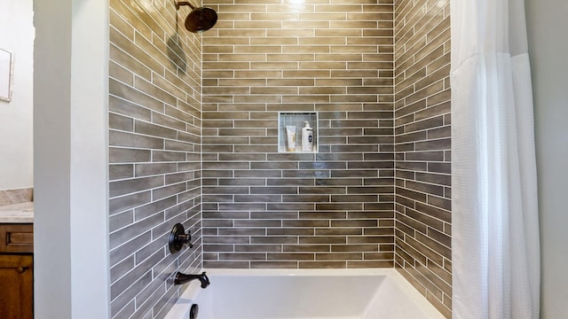 bathroom with shower / bath combo and vanity