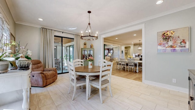 dining room with a chandelier, baseboards, ornamental molding, and recessed lighting
