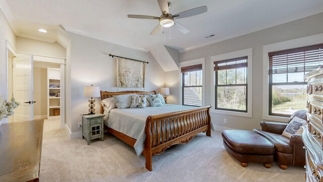 bedroom featuring visible vents, light colored carpet, baseboards, and ceiling fan