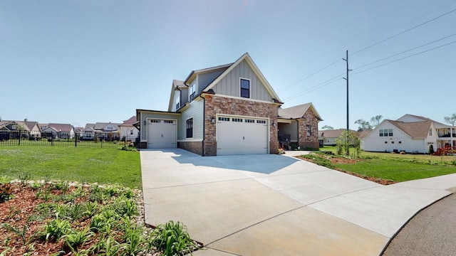 craftsman-style home with board and batten siding, a front yard, fence, and stone siding
