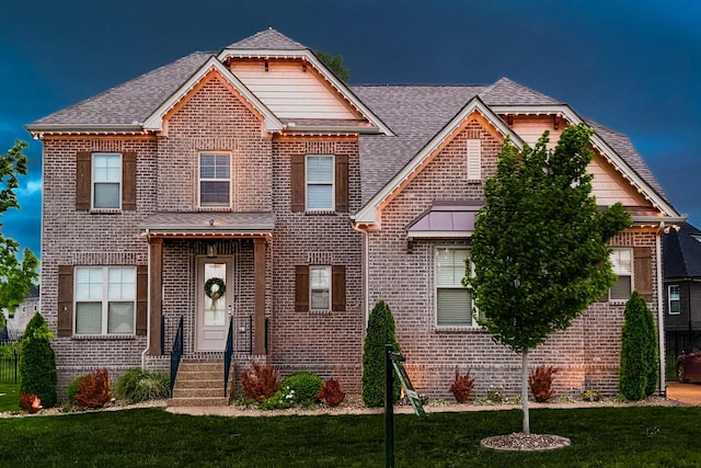 1055 Appaloosa Way, Gallatin, TN 37066 - view of front facade with roof with shingles, brick siding, and a front yard