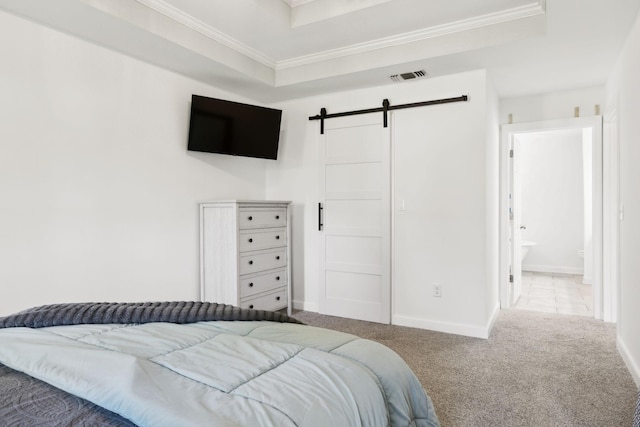 1046 Huntsman Cir, Franklin, TN 37064 - carpeted bedroom featuring a barn door, ornamental molding, baseboards, and a tray ceiling