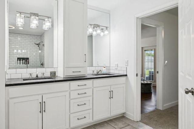 1046 Huntsman Cir, Franklin, TN 37064 - full bath with double vanity, tiled shower, and backsplash