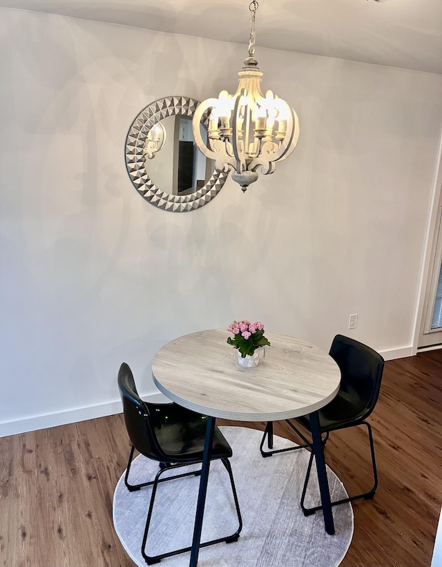 1046 Huntsman Cir, Franklin, TN 37064 - dining room featuring a chandelier, baseboards, and wood finished floors