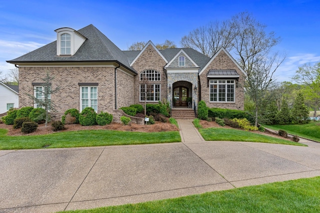 6685 Hastings Ln, Franklin, TN 37069 - view of front of house featuring brick siding, french doors, and a front yard