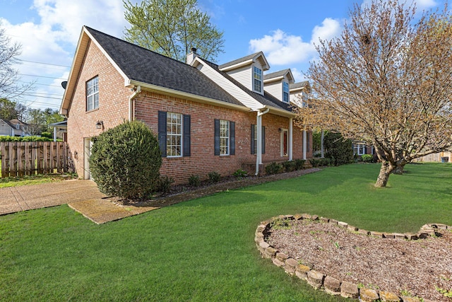 142 Big Ben Ct, Franklin, TN 37067 - view of side of home featuring a lawn, a garage, fence, brick siding, and driveway
