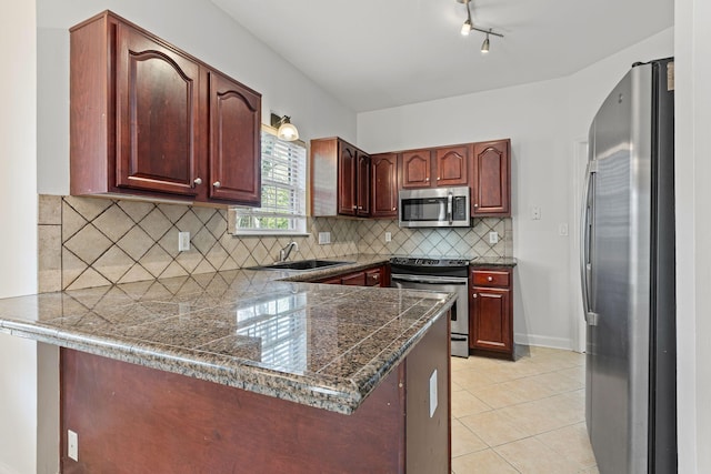142 Big Ben Ct, Franklin, TN 37067 - kitchen featuring tile countertops, light tile patterned floors, a peninsula, appliances with stainless steel finishes, and a sink