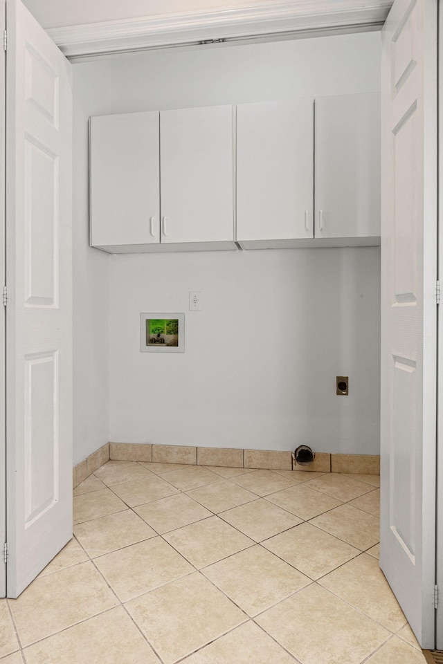 142 Big Ben Ct, Franklin, TN 37067 - laundry room with cabinet space, hookup for an electric dryer, light tile patterned flooring, and hookup for a washing machine