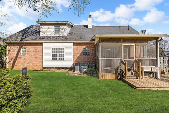 142 Big Ben Ct, Franklin, TN 37067 - back of house featuring a sunroom, a yard, brick siding, a chimney, and central AC unit