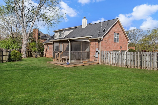 142 Big Ben Ct, Franklin, TN 37067 - rear view of house with a sunroom, a fenced backyard, a lawn, brick siding, and a chimney