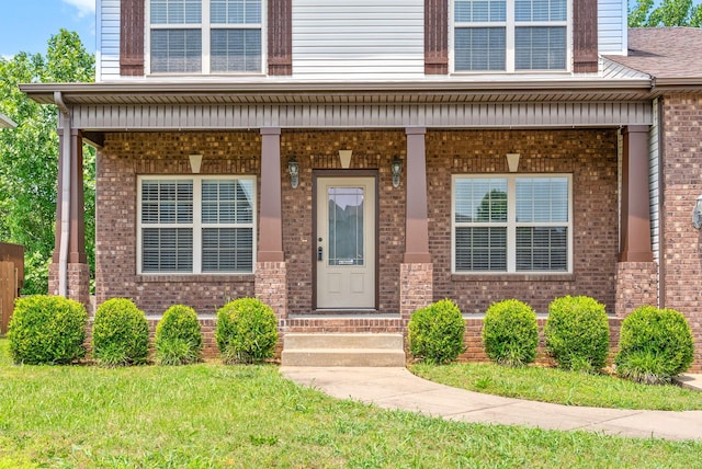 1313 Allmon Dr, Clarksville, TN 37042 - doorway to property with brick siding and a yard