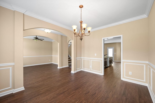 1313 Allmon Dr, Clarksville, TN 37042 - spare room featuring arched walkways, stairs, crown molding, a chandelier, and dark wood-style flooring