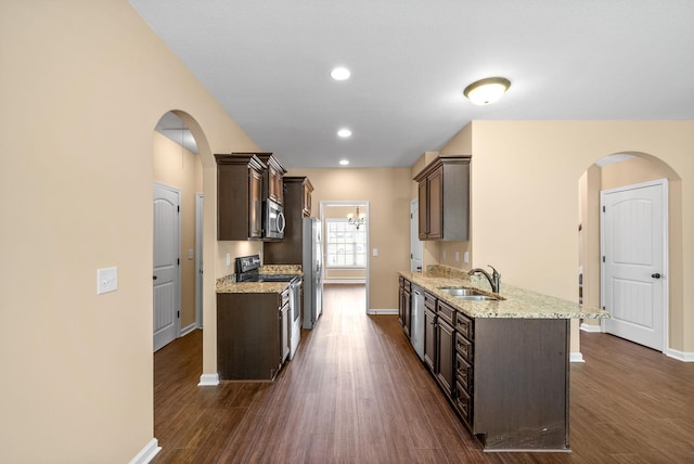 1313 Allmon Dr, Clarksville, TN 37042 - kitchen featuring stainless steel appliances, dark brown cabinets, baseboards, and recessed lighting