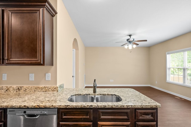 1313 Allmon Dr, Clarksville, TN 37042 - kitchen with stainless steel dishwasher, a sink, dark brown cabinets, and wood finished floors